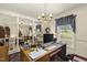 Functional home office with natural light and a classic chandelier, perfect for a productive work environment at 6517 Whitted Rd, Fuquay Varina, NC 27526