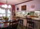 Kitchen and eat-in dining area with a view of vintage decoration, furniture and natural light perfect for meals at 6517 Whitted Rd, Fuquay Varina, NC 27526