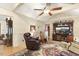 Spacious living room boasts a ceiling fan and a large entertainment center at 6517 Whitted Rd, Fuquay Varina, NC 27526