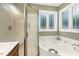 Spa-like bathroom featuring a large soaking tub and separate glass-enclosed shower at 6517 Whitted Rd, Fuquay Varina, NC 27526