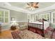 Spacious bedroom with tray ceilings, bay window, sitting area, and hardwood flooring at 6517 Whitted Rd, Fuquay Varina, NC 27526