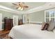 Spacious bedroom with tray ceilings, bay window, sitting area, and hardwood flooring at 6517 Whitted Rd, Fuquay Varina, NC 27526