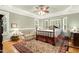 Spacious bedroom with tray ceilings, bay window, sitting area, and hardwood flooring at 6517 Whitted Rd, Fuquay Varina, NC 27526
