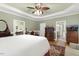 Spacious bedroom with tray ceilings, bay window, sitting area, and hardwood flooring at 6517 Whitted Rd, Fuquay Varina, NC 27526