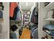 Organized walk-in closet with hardwood floors and ample storage for clothes and accessories at 6517 Whitted Rd, Fuquay Varina, NC 27526