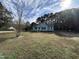 A quaint single-story home featuring a cozy entrance and expansive front lawn at 803 Flat Rock Church Rd, Louisburg, NC 27549