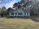Charming single-story home featuring a welcoming entrance and manicured front lawn at 803 Flat Rock Church Rd, Louisburg, NC 27549