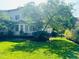 Lush backyard view featuring a deck and well-maintained lawn and landscaping at 8729 Valentine Ct, Raleigh, NC 27613
