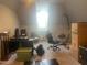 Bonus room with angled walls, desk, and seating area at 8729 Valentine Ct, Raleigh, NC 27613