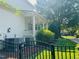 Side exterior showing brick, backyard with a fence, patio, and well-maintained landscaping at 8729 Valentine Ct, Raleigh, NC 27613