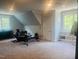 Home gym with window, fitness equipment, ceiling fan and built-in storage at 8729 Valentine Ct, Raleigh, NC 27613