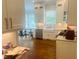 Bright kitchen features white cabinets, stainless steel appliances, granite countertops, and an island at 8729 Valentine Ct, Raleigh, NC 27613