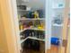 Walk-in pantry with ample shelving, providing plenty of storage space for food and kitchen supplies at 8729 Valentine Ct, Raleigh, NC 27613