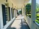 Inviting front porch with columns and rocking chairs, perfect for relaxing outdoors at 8729 Valentine Ct, Raleigh, NC 27613