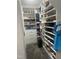 Walk-in closet with racks and storage drawers at 8729 Valentine Ct, Raleigh, NC 27613