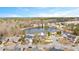 A stunning aerial view of a community with a pond and lush greenery at 930 Pristine Ln, Rolesville, NC 27571