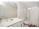Bright bathroom with vanity, sink, mirror, toilet, and shower with curtain at 930 Pristine Ln, Rolesville, NC 27571