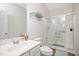 Bathroom with a walk-in shower, sink with faucet, toilet, and towel rack at 930 Pristine Ln, Rolesville, NC 27571