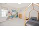 Bright bedroom featuring a whimsical under the sea wall mural, bed frame, and window at 930 Pristine Ln, Rolesville, NC 27571