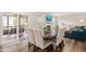 Dining area with large sliding glass doors and a view of the fireplace at 930 Pristine Ln, Rolesville, NC 27571