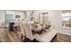 Bright dining area featuring a large table, seating, and an open kitchen at 930 Pristine Ln, Rolesville, NC 27571