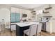 Well-lit kitchen featuring a center island, stainless steel appliances and modern cabinets at 930 Pristine Ln, Rolesville, NC 27571