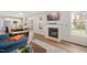 Open concept home with living room, kitchen, dining area, and modern fireplace at 930 Pristine Ln, Rolesville, NC 27571