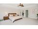 Main bedroom with neutral carpet, trey ceiling, and doorway to an adjacent room at 930 Pristine Ln, Rolesville, NC 27571