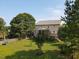 Expansive backyard with lush lawn, privacy fence, and mature trees; perfect for outdoor activities at 947 Middle Ground Ave, Rolesville, NC 27571