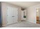 Bedroom with a double closet, soft neutral walls, and carpeted floors at 947 Middle Ground Ave, Rolesville, NC 27571