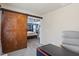 Open view to bedroom with a sliding barn door and space for a desk or sitting area at 947 Middle Ground Ave, Rolesville, NC 27571