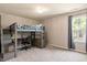 Bedroom featuring a bunk bed with built-in desk and ample natural light at 947 Middle Ground Ave, Rolesville, NC 27571