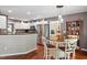 Bright breakfast nook adjacent to the kitchen with stylish pendant lighting, ideal for casual dining at 947 Middle Ground Ave, Rolesville, NC 27571