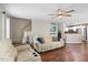 Open-concept living room featuring hardwood floors, neutral tones, and a staircase, perfect for modern living at 947 Middle Ground Ave, Rolesville, NC 27571