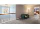 Open loft area features a comfortable seating area and view to the downstairs at 947 Middle Ground Ave, Rolesville, NC 27571