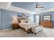Inviting main bedroom with trey ceilings, ceiling fan and craftsman-style furniture at 947 Middle Ground Ave, Rolesville, NC 27571