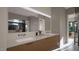 Contemporary bathroom with dual vanities, large mirror, and ample counter space at 10 Gambel Dr, Youngsville, NC 27596