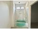 Bathroom featuring tiled shower, a window, and a tub offering potential for a relaxing space at 10 Gambel Dr, Youngsville, NC 27596