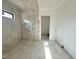 Modern bathroom with elegant marble tile and shower niche, under construction at 10 Gambel Dr, Youngsville, NC 27596
