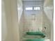Bathroom featuring a tub with white subway tile surround and niche at 10 Gambel Dr, Youngsville, NC 27596