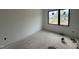 Bright bedroom featuring a modern window overlooking a serene neighborhood at 10 Gambel Dr, Youngsville, NC 27596