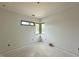 Bedroom with corner window showcasing nature views and abundant natural light at 10 Gambel Dr, Youngsville, NC 27596