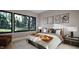 Inviting bedroom with natural light, large windows, accent chair, and coordinated decor at 10 Gambel Dr, Youngsville, NC 27596