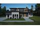 Stunning modern home with a sleek design, mixed materials, and manicured landscaping for curb appeal at 10 Gambel Dr, Youngsville, NC 27596