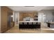 Kitchen featuring a large island with bar seating, stainless steel appliances, and light wood cabinets at 10 Gambel Dr, Youngsville, NC 27596