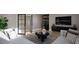 Open-concept living area with a sleek bar, modern furniture, and ample space for entertaining guests at 10 Gambel Dr, Youngsville, NC 27596