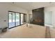Open-concept living room features sliding glass doors, tile-ready fireplace and construction debris at 10 Gambel Dr, Youngsville, NC 27596