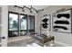 Well-lit office with a modern desk, abstract artwork, and large windows overlooking the property at 10 Gambel Dr, Youngsville, NC 27596
