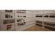 Well-organized pantry with custom shelving, providing ample storage for all your culinary needs at 10 Gambel Dr, Youngsville, NC 27596