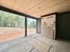 Covered patio with a view, wood plank ceiling, and construction materials staged at 10 Gambel Dr, Youngsville, NC 27596